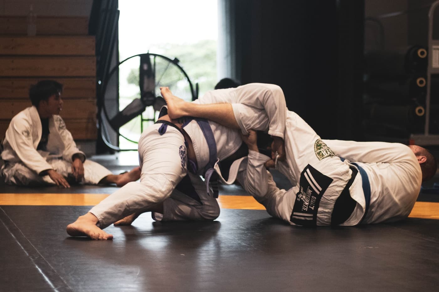 Jiujitsu athletes training on the mat